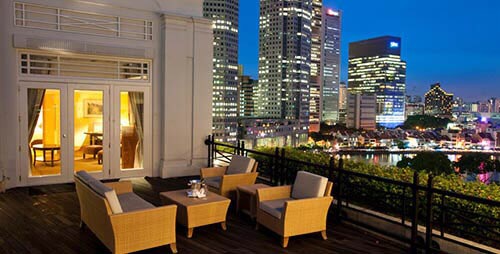 The Fullerton Suite balcony in the evening.
